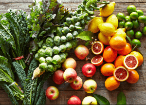 a group of fruits and vegetables on a wood surface Healthy Weight Loss Diets Highworth